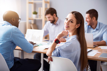 Charming smiling woman working in the office