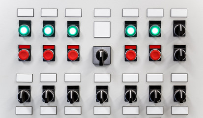 Control panel of industrial equipment with name plates, switches