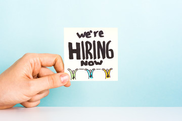 Hand over desk showing a message 