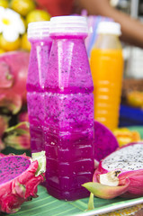 Freshly squeezed juices are sold at a market in Bangkok
