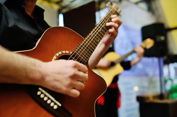 Fototapeta premium two musicians playing guitars