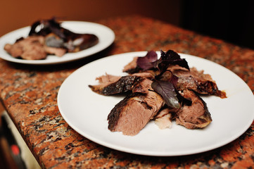 skewers of lamb with basil leaves