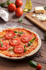 italian homemade pizza with ingredients