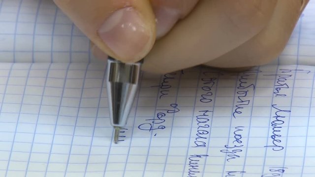 Take Notes of a Lecture. Write Letters in a Notebook in a Cage. Writing in a Notebook. Closeup. Children, Scool, Education