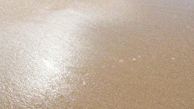 Shallow water sparkling sea beach and sand 4K 2160p 30fps UltraHD video - Summer vacation fine ocean beach golden sand 4K 3840X2160 UHD footage