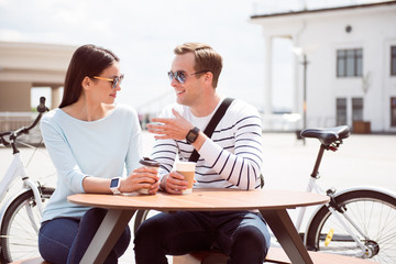 Fototapeta na wymiar Man and woman sitting at cafe