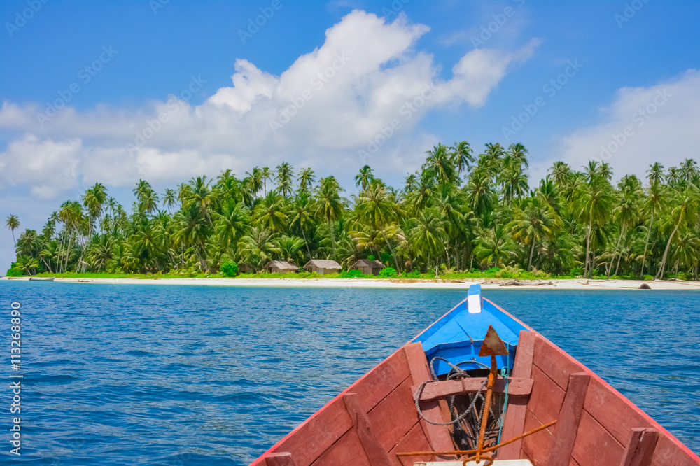 Wall mural boat trip to remote tropical island