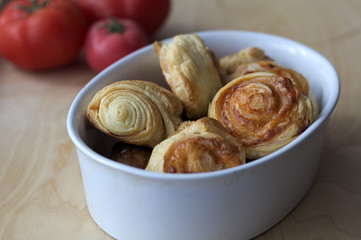 Dry spiral puff pastry as small pizzas