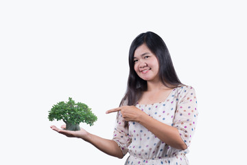 woman  with tree in hand. isolated on the white bakckground.