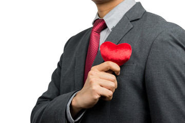 Businessman holding red heart isolated on white background with clipping path. Service mind concept.