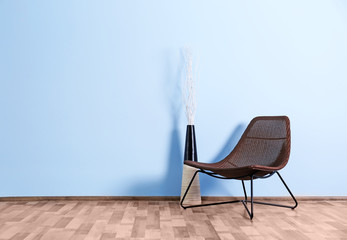 Empty room with wicker chair  on blue wall background