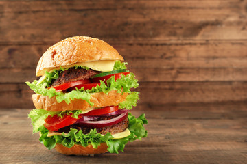 Double hamburger on wooden background