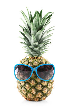 Pineapple with sunglasses, isolated on white