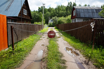 Stop sign on rural unpaved road