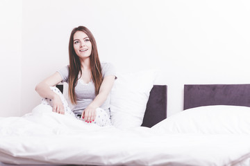 Attractive woman in the bed.