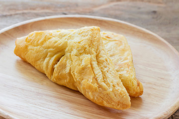Chicken pie on a wooden plate