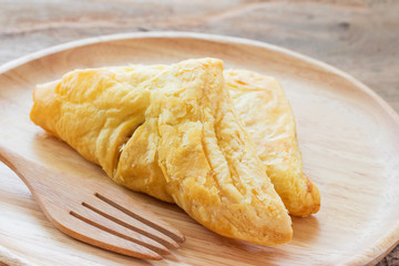 Chicken pie on a wooden plate