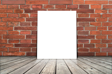 Poster stand on wooden floor with brick wall. You can write some