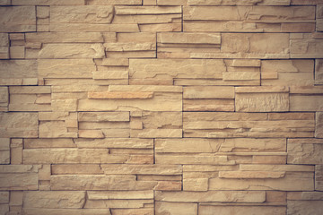 Close up light brown stone wall texture background 