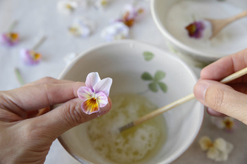 Crystallized Candied Edible Flowers with egg whites and sugar,selective focus