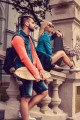 Obraz premium Casual longboarders posing in a town.