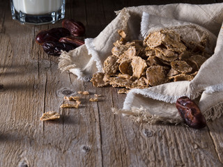 cereal; breakfast; healthy eating; milk; wood background; date; vitamins; space for text; brown; cereal; carbohydrates; rich; cheerfulness; muesli
