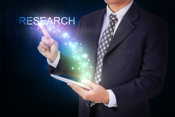 Businessman holding tablet with pressing research. internet and networking concept 