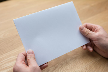 Fototapeta premium businessman holding white blank paper