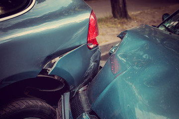 Close up smached cars on a road.
