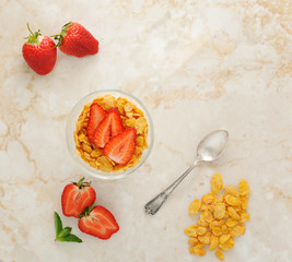 corn flakes and strawberries for Breakfast