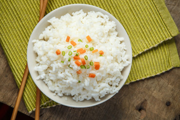 Jasmine rice with chopsticks on a fabric mat