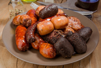 Lots of Spanish sausage roasted in earthenware