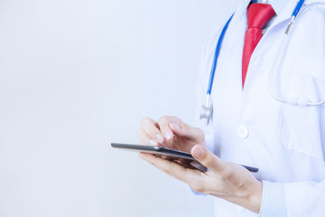 Doctor using tablet in white isolated background
