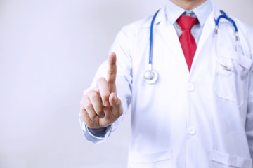 Doctor touching virtual screen in white background