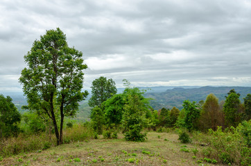 Obraz premium Top view of naturel mountains landscape with black rain clouds in the rainy season