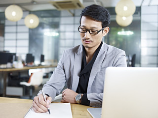 asian businessman working in office