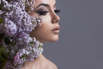 make-up.Young woman with flowers