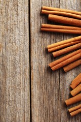 Cinnamon on a grey wooden background