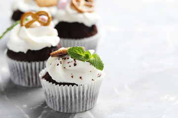 Chocolate cupcakes on a grey background