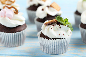 Chocolate cupcakes on a blue wooden table