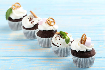 Chocolate cupcakes on a blue wooden table