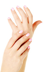 Female hand with manicure on a white background
