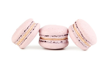 Obraz na płótnie Canvas French pink macarons isolated on a white