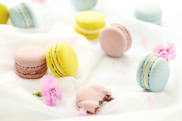 French colorful macarons on a white cloth