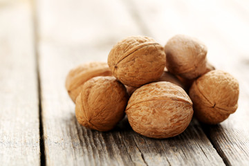 Walnuts on a grey wooden table