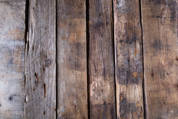 Wooden background from old raw boards 