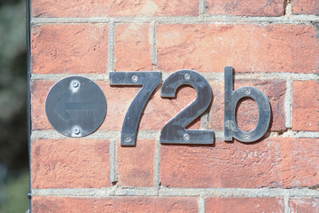 House number 72B sign