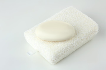Fototapeta na wymiar soap on a white sponge on a white isolated background