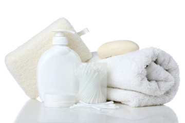 personal hygiene products on white wooden table on green background