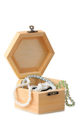 outdoor wooden casket isolated on white background with beads and jewels